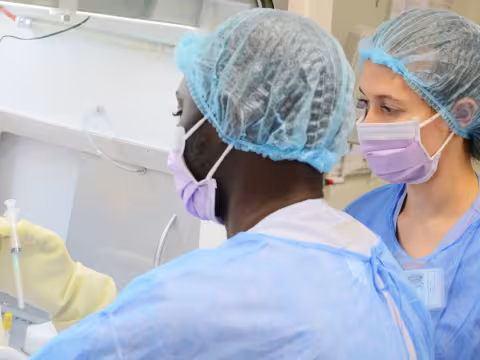 Photograph of two radiopharmacy staff members